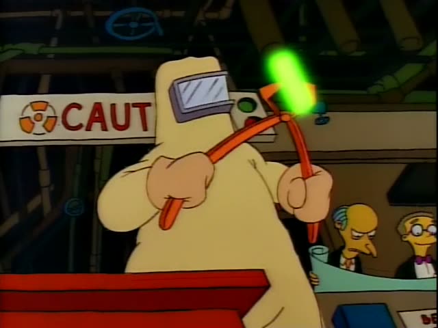 Homer handles a glowing green rod with orange tongs in a control booth beneath a CAUTION sign, while Mr. Burns and Smithers…