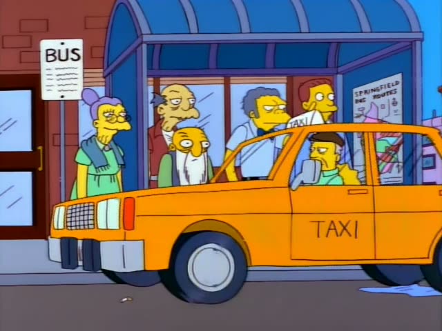 Lisa stands at a Springfield bus stop beside a grey-haired, thin old man in a red jumpsuit who looks like Mr. Burns…