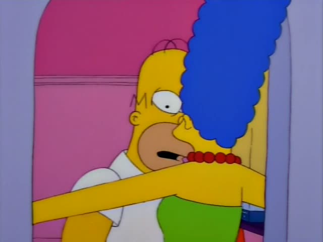 Homer and Marge stand in a pink archway, where he hugs her and then pulls back, mouth open in alarm