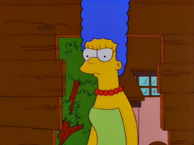 Marge and Bart stand together in front of a brown log wall beside a green bush and a small window