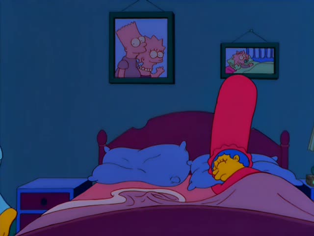 A heavy yellow-skinned man with swept-back reddish hair, in a light shirt and then a grey top, starts in a dim blue bedroom…