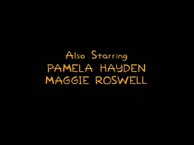 A black screen of end credits in orange lettering