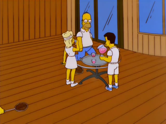 On a wooden deck beside a round glass-topped table, a dark-haired man in white tennis clothes pours pink lemonade…