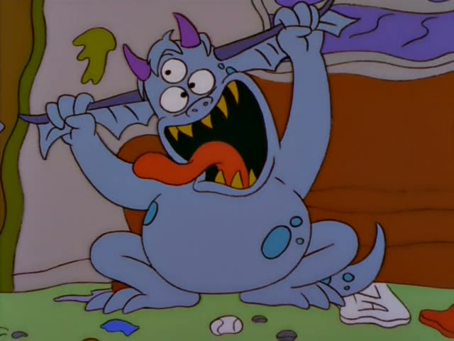 A blue, horned, bat-winged monster sits on a grimy floor in a cluttered room with a brown door marked MEN, first gripping…