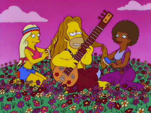 Homer sits in a field of flowers playing a sitar-like instrument while a blonde woman in a headband and a woman with a big…