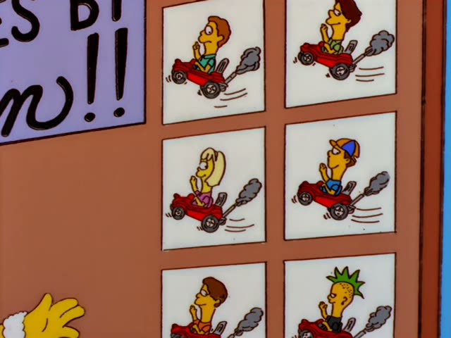 Outside a sports booth labeled "Catch a Pass from Dan Marino," a man in a green polo with arms crossed watches…