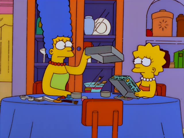 Marge and Lisa sit at a blue-draped dining table in front of a wooden china cabinet
