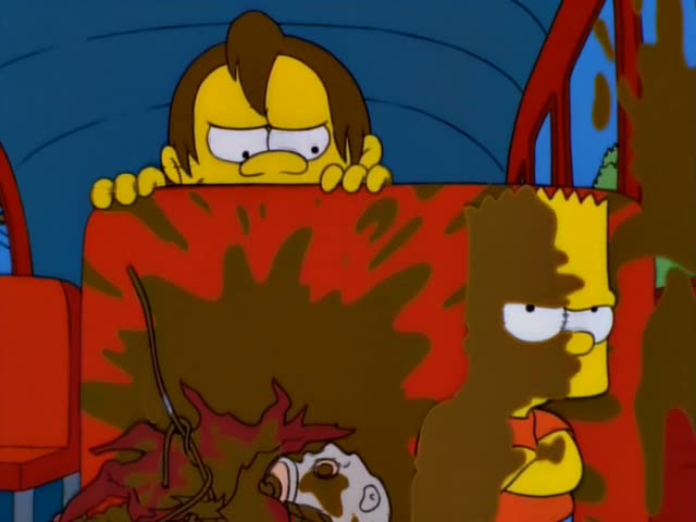Bart sits on a red bus seat beside a brown-haired boy who peeks over the seat and grins, then grimaces