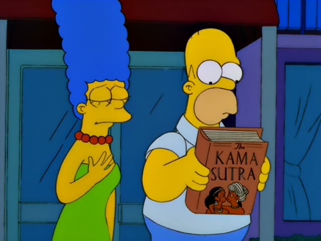 Marge stands at the left with one hand on her chest outside the blue front door of the house