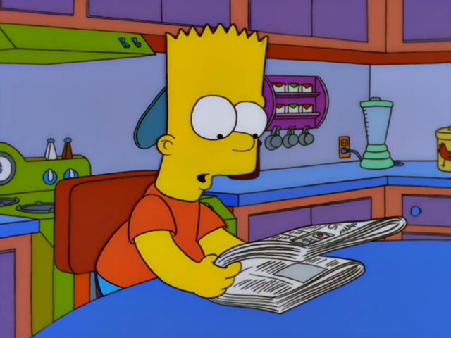 Bart sits at a blue kitchen table reading a newspaper spread open in his hands, glancing up with a sly smile and a wide grin