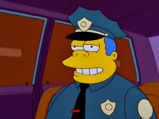 Chief Wiggum sits in the back of a car, grimacing and then talking with his eyes half shut