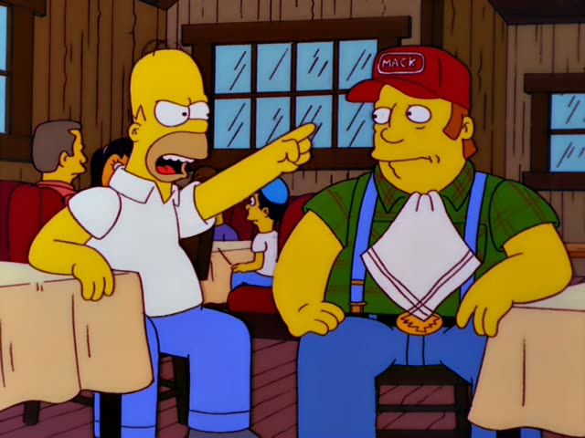 Homer and a heavy man in a red MACK cap, green plaid shirt, blue suspenders and a tucked-in napkin sit at a wooden diner…