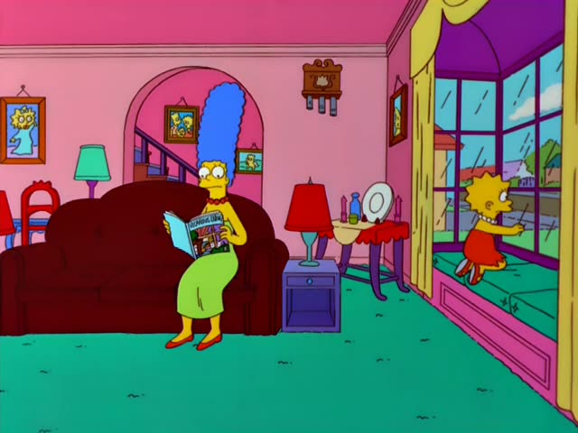 Marge Simpson sits on the dark red couch in her green dress and red beads, reading a magazine and glancing up in alarm…
