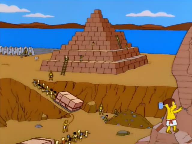 Bart first chisels at a giant sphinx-like statue while workers haul a stone block on a sled through a sandy trench…