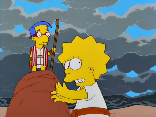 Milhouse stands in a striped robe on a red rock holding a staff, and Lisa stands beside him with her arms raised…